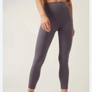 Athleta Stash Pocket Salutation Tight in Charcoal